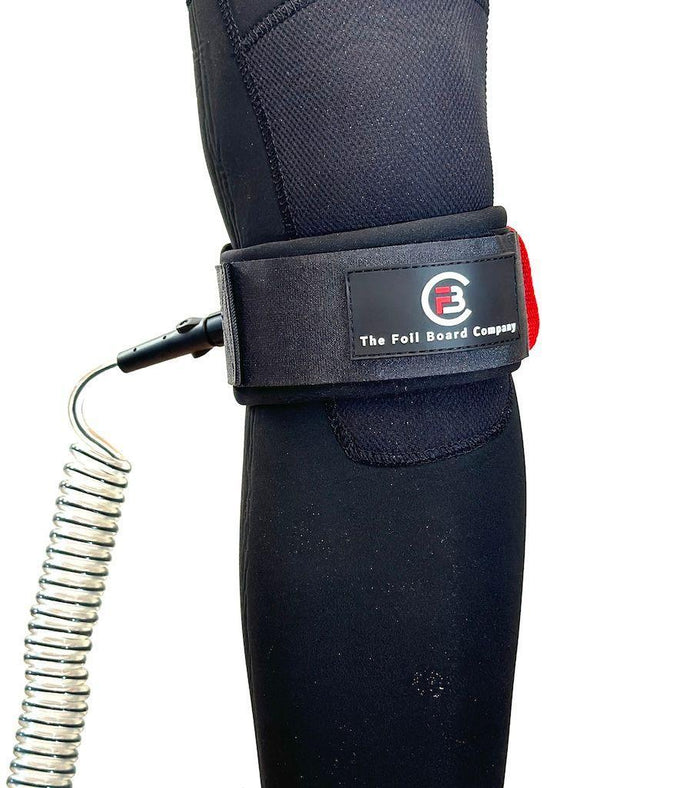 The Foil Board Company black knee leash with coiled cord for wing foiling and SUP