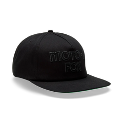 Black Moto-1 Fox cap with green brim, watersports gear for Whitstable surfers