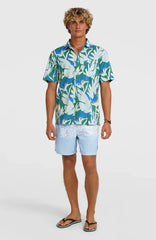 Man wearing Billabong tropical print shirt & light blue board shorts for watersports in Whitstable