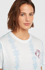 White tie-dye surf tee with purple flower graphic, ideal for watersports in Whitstable, Kent