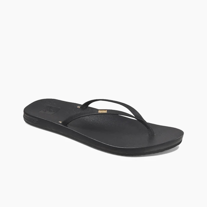 Black OluKai flip flop with gold logo, watersports beachwear for Whitstable Kent