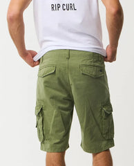 Rip Curl mid green cargo shorts with flap pockets, shown from the back on a model