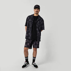 Black floral surf shirt and shorts set with matching cap, ideal for watersports in Whitstable.