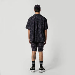 Black patterned surf shirt and shorts set for watersports