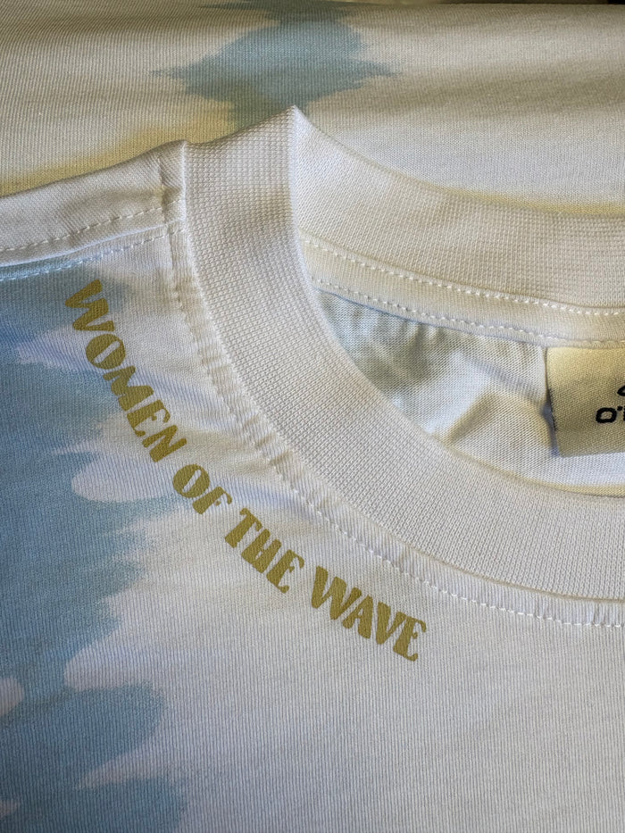 Women of the Wave surf tee, cream with gold text, watersports beachwear